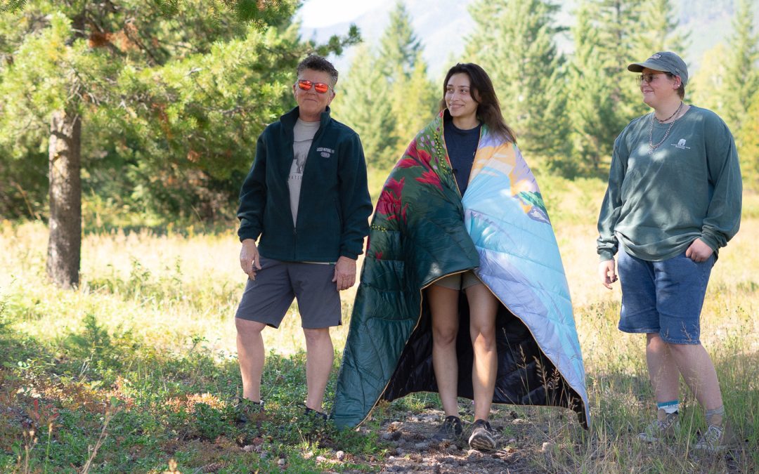 Modeling GNPC products in a meadow.