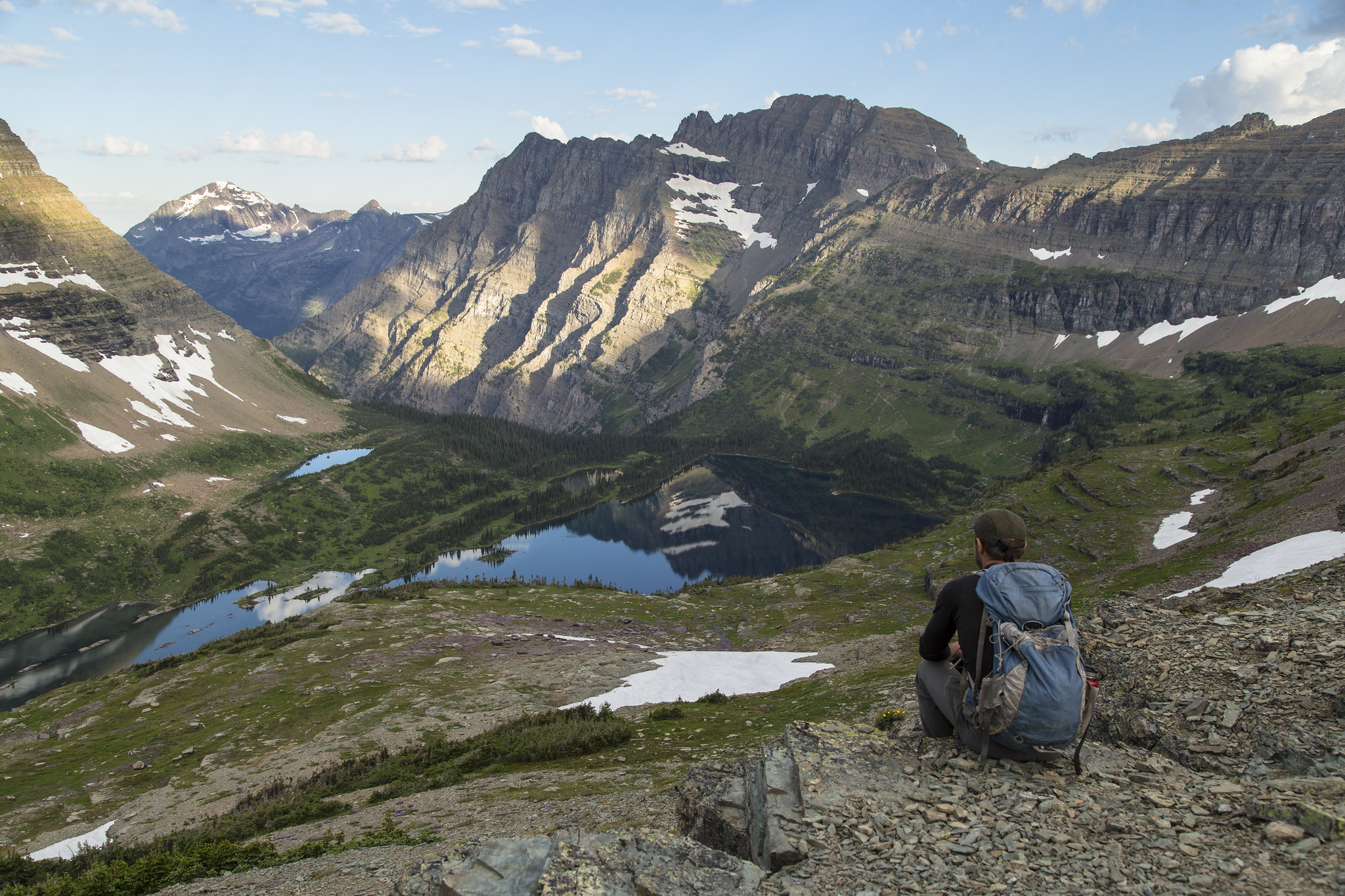 A hiker overlooking a lake.