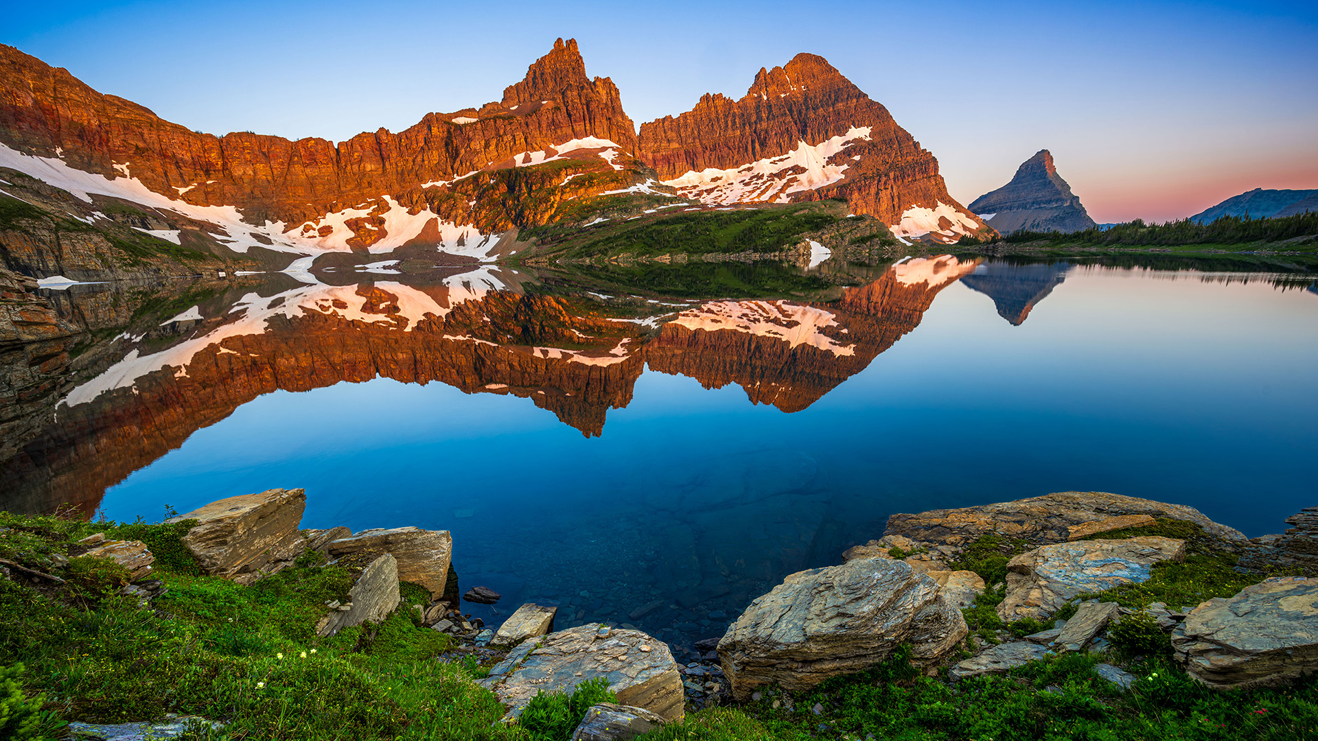 Mountains reflecting on an alpine lake.
