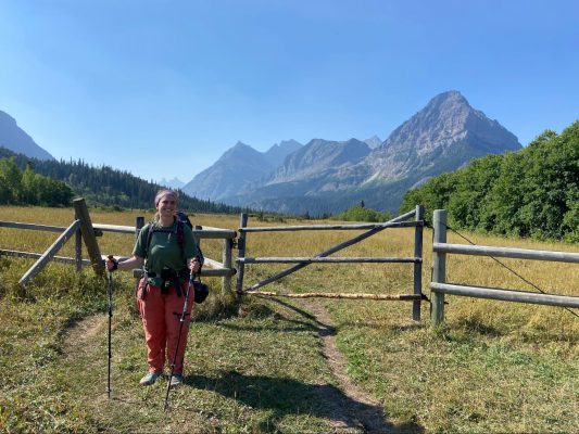 Christa poses on a hiking trail.