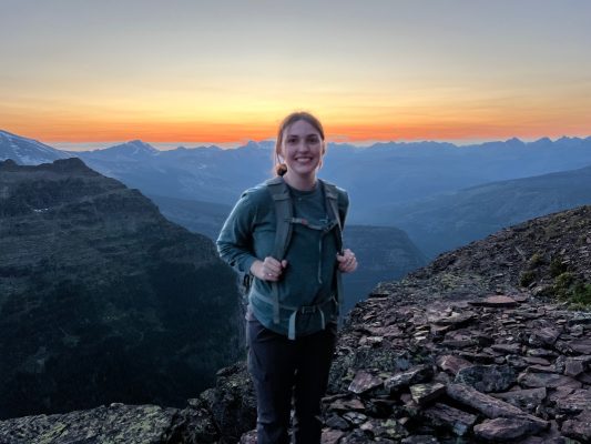 Mallory poses before sunset on the mountains.