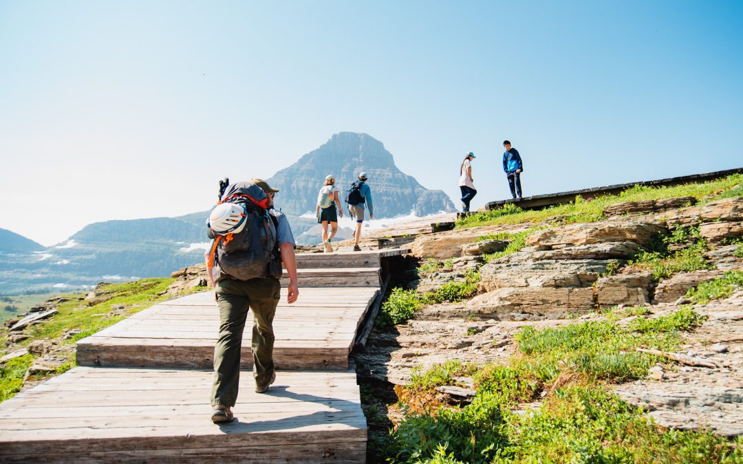 A ranger hikes up the Hidden Lake boardwalk.